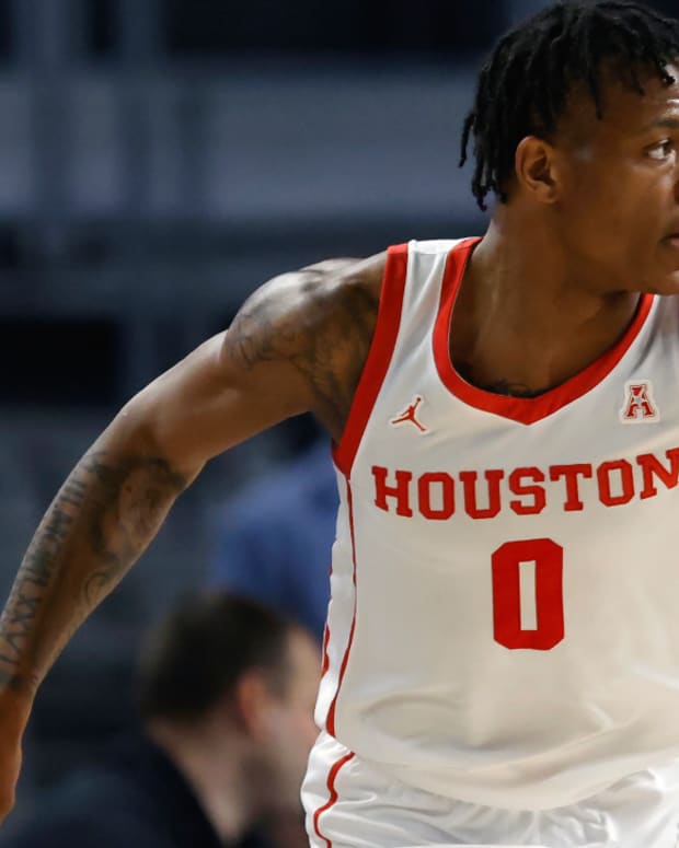 Houston guard Marcus Sasser (0) reacts after scoring a three point basket against East Carolina during the second half of an NCAA college basketball game in the quarterfinals of the American Athletic Conference Tournament, Friday, March 10, 2023, in Fort Worth, Texas. Houston won 60-46. (AP Photo/Ron Jenkins)